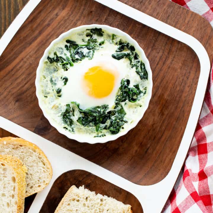 baked eggs in ramekins with spinach and cream
